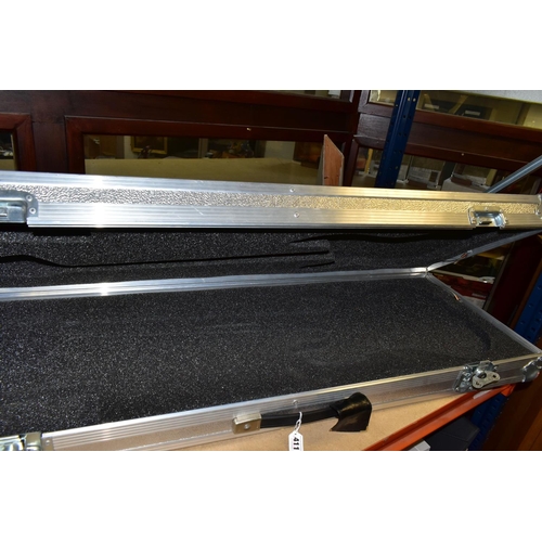 411 - A GUITAR FLIGHT CASE, in aluminium, having ball corners, shaped foam lining, and butterfly fastening... 