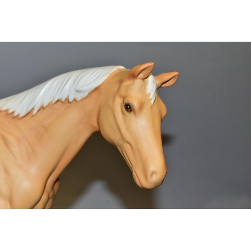 437 - A ROYAL DOULTON 'SUNBURST' FIGURE of a Palomino horse, similar to Beswick model no 2671, in a matt f... 