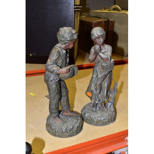 454 - TWO COLD PAINTED SPELTER FIGURES, of a young boy with a straw hat and girl carrying a wicker hamper,... 