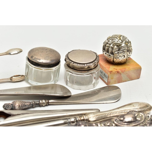 156 - ELEVEN SILVER NOVELTIES, mainly early 20th century pieces, to include sugar tongs, two button hooks ... 