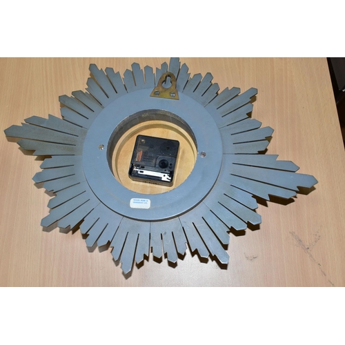 380 - A TEMPORA SUNBURST CLOCK, battery powered quartz, width 42cm x height 30cm x diameter of face 11.5cm... 