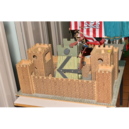 481 - AN EARLY LEARNING CENTRE CASTLE AND PIRATE SHIP, the castle on baseboard measuring 62cm x 61cm, havi... 