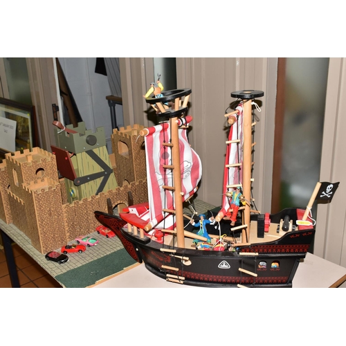 481 - AN EARLY LEARNING CENTRE CASTLE AND PIRATE SHIP, the castle on baseboard measuring 62cm x 61cm, havi... 