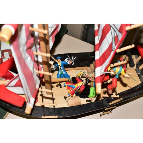 481 - AN EARLY LEARNING CENTRE CASTLE AND PIRATE SHIP, the castle on baseboard measuring 62cm x 61cm, havi... 