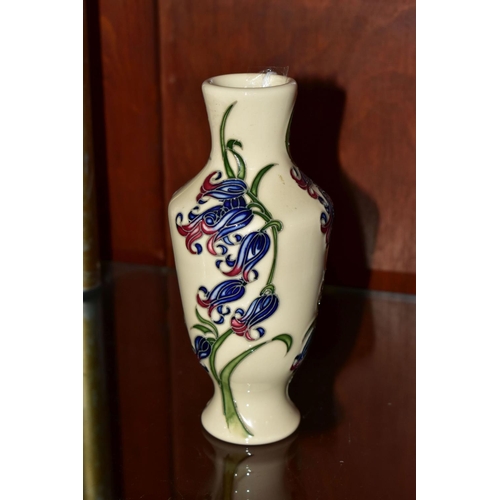 497 - A MOORCROFT POTTERY BLUEBELL HARMONY VASE, the footed vase decorated in the Bluebell Harmony pattern... 