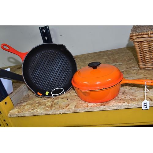 327 - A SET OF LE CREUSET VOLCANIC ORANGE CAST IRON OVEN WARE, comprising a classic 23cm  lidded saucepan/... 