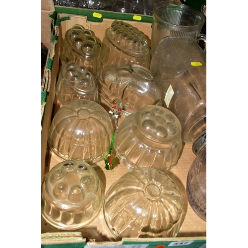 347 - THREE BOXES OF GLASSWARES, to include nine clear glass jelly moulds, pressed glass fruit bowls, a la... 