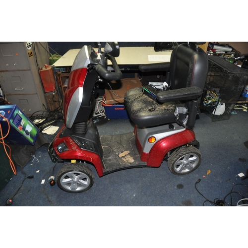 1002 - A KYMCO FOUR WHEELED MOBILITY SCOOTER with one key, charger, front and rear baskets (PAT pass and wo... 