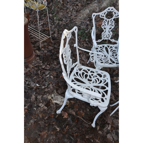 1007 - A PAINTED ALUMINIUM GARDEN TABLE 79cm in diameter and three chairs (4)