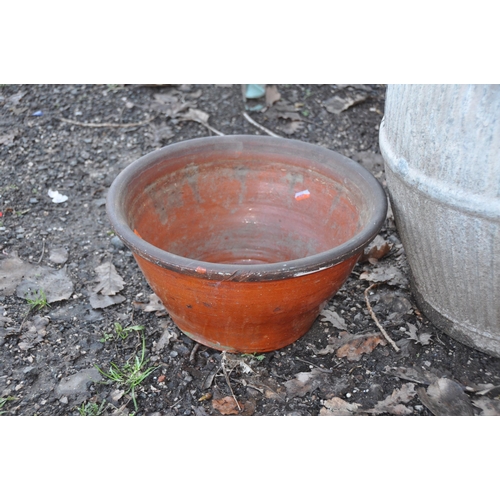 1009 - A VINTAGE GALVANISED DOLLY TUB 52cm high and a Terracotta planter 39cm in diameter (2)