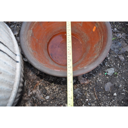 1009 - A VINTAGE GALVANISED DOLLY TUB 52cm high and a Terracotta planter 39cm in diameter (2)