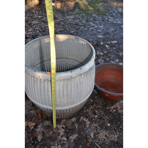 1009 - A VINTAGE GALVANISED DOLLY TUB 52cm high and a Terracotta planter 39cm in diameter (2)