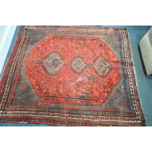 1309 - A TURKISH MILAS WOOLEN RUG, geometric design within a black field, 163cm x 115cm and a similar large... 