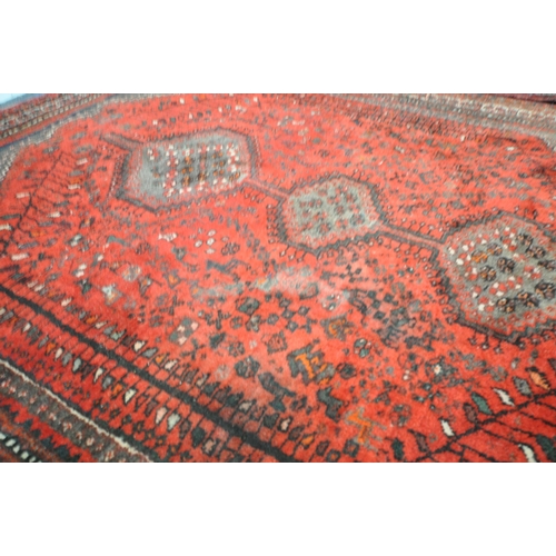 1309 - A TURKISH MILAS WOOLEN RUG, geometric design within a black field, 163cm x 115cm and a similar large... 