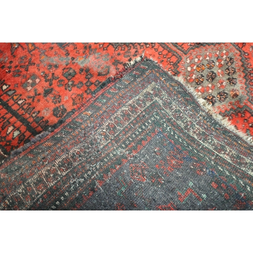 1309 - A TURKISH MILAS WOOLEN RUG, geometric design within a black field, 163cm x 115cm and a similar large... 