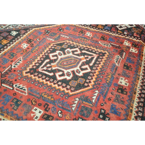 1309 - A TURKISH MILAS WOOLEN RUG, geometric design within a black field, 163cm x 115cm and a similar large... 