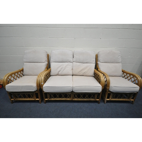 1310 - A WICKER THREE PIECE CONSERVATORY SUITE, comprising a two seater settee and a pair of armchairs (3)