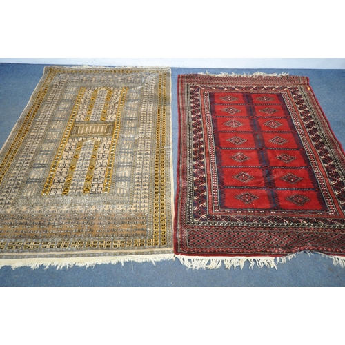 1321 - TWO 20TH CENTURY WOOLLEN RUGS one with red field 186cm x 124cm and the other russet coloured, 198cm ... 