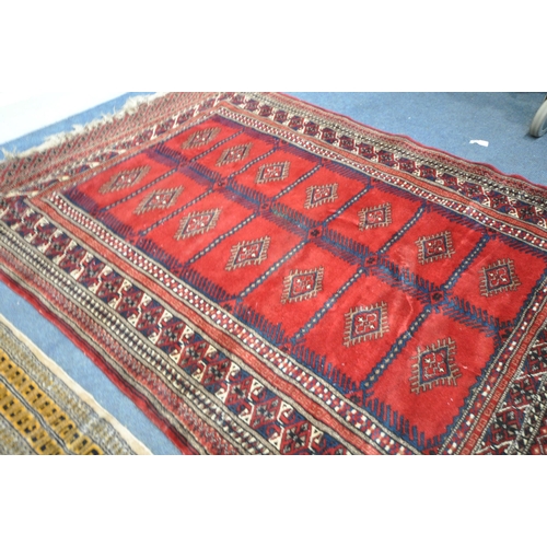 1321 - TWO 20TH CENTURY WOOLLEN RUGS one with red field 186cm x 124cm and the other russet coloured, 198cm ... 