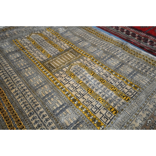 1321 - TWO 20TH CENTURY WOOLLEN RUGS one with red field 186cm x 124cm and the other russet coloured, 198cm ... 