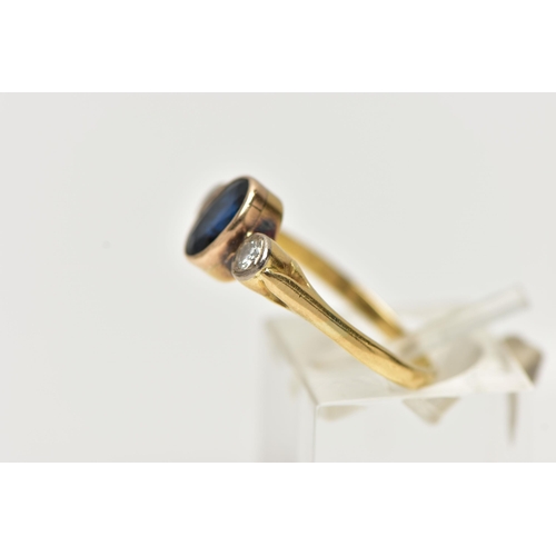 7 - A YELLOW METAL SAPPHIRE AND DIAMOND RING, centering on an oval cut deep blue sapphire, collet set, f... 