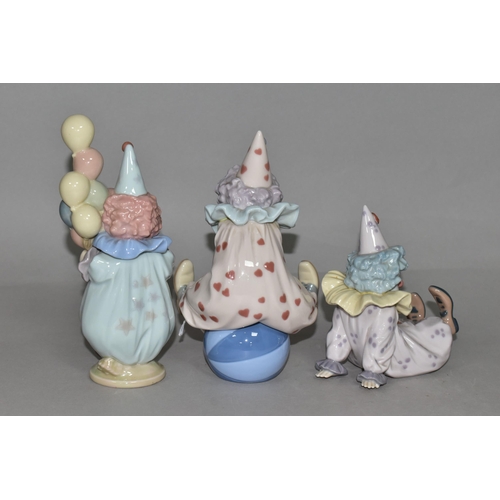 351 - THREE LLADRO CLOWNS, comprising 'Littlest Clown' 5811, 'Having a Ball' 5813, 'Tired Friend' 5812, de... 