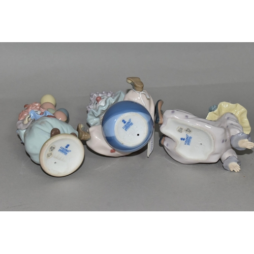 351 - THREE LLADRO CLOWNS, comprising 'Littlest Clown' 5811, 'Having a Ball' 5813, 'Tired Friend' 5812, de... 