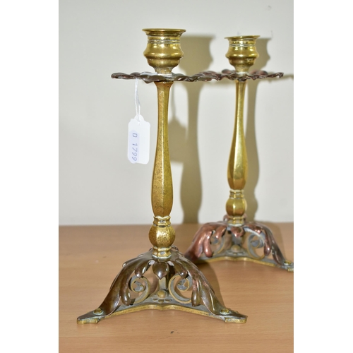 367 - A PAIR OF BRASS AND COPPER CANDLESTICKS, in the form of flowers with foliate scrolling bases height ... 