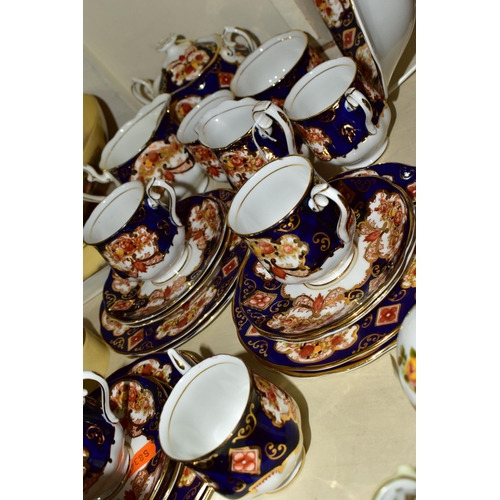 393 - A TWENTY THREE PIECE ROYAL ALBERT 'HEIRLOOM' PATTERN TEA SET, comprising six cups (two have small un... 