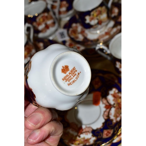 393 - A TWENTY THREE PIECE ROYAL ALBERT 'HEIRLOOM' PATTERN TEA SET, comprising six cups (two have small un... 