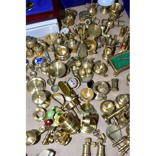 406 - A COLLECTION OF MINIATURE BRASS ITEMS TOGETHER WITH EIGHT BOXED ATLAS DECORATIVE EGGS, comprising a ... 