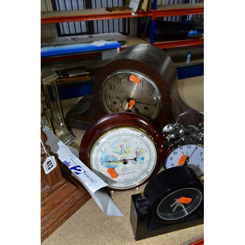 413 - A GROUP OF SEVEN CLOCKS, comprising a chrome alarm clock, quartz black mantel clock, a wooden 'Halle... 