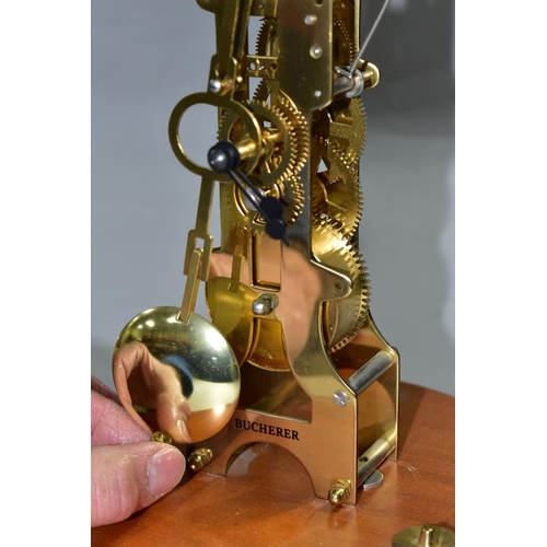 458 - A MODERN FRANZ HERMLE SKELETON CLOCK, marked Bucherer on the front, with a  pendulum, movement strik... 