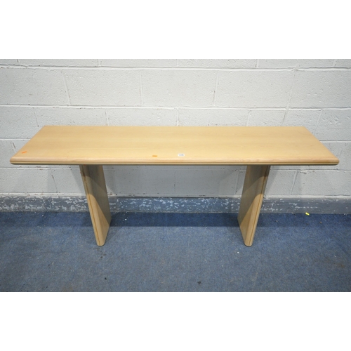 1200 - A DANISH STYLE LIGHT ASH CONSOLE SIDE TABLE, with a fold over extending top, on twin legs, length 16... 