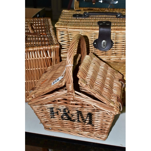 513 - SIX WICKER BASKETS, comprising a small Fortnum and Masons hamper together with a small handled F&M b... 