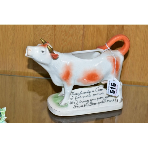 516 - TWO COW CREAMERS, both with brown patches, comprising an early twentieth century Royal Dux cow cream... 