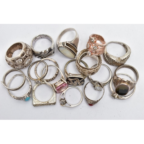 100 - AN ASSORTMENT OF SILVER AND WHITE METAL RINGS, to include a silver ring set with a heart cut cubic z... 