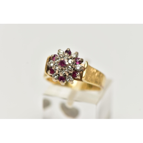 70 - AN 18CT GOLD RUBY AND DIAMOND CLUSTER RING, designed as a tiered cluster set throughout with circula... 