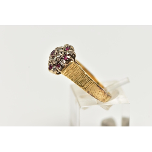 70 - AN 18CT GOLD RUBY AND DIAMOND CLUSTER RING, designed as a tiered cluster set throughout with circula... 