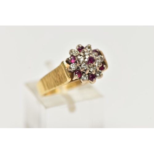 70 - AN 18CT GOLD RUBY AND DIAMOND CLUSTER RING, designed as a tiered cluster set throughout with circula... 