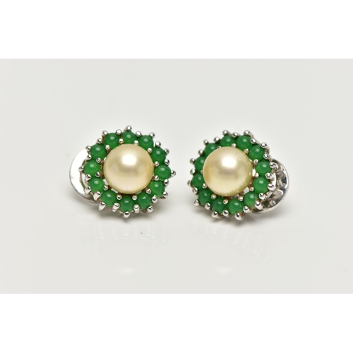 78 - A PAIR OF IMITATION PEARL AND PASTE EARRINGS, each ear clip set with an imitation pearl surrounded b... 