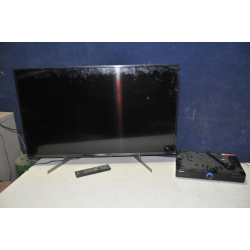 1059 - A SONY KD-43XH8196 43in TV with remote along with a Humax Freeview plus box with remote (both PAT pa... 