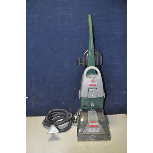 1063 - A BISSELL POWERWASH 1960J UPRIGHT CARPET CLEANER along with a VAX blade cordless vacuum cleaner (no ... 