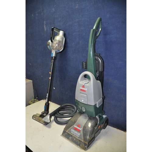 1063 - A BISSELL POWERWASH 1960J UPRIGHT CARPET CLEANER along with a VAX blade cordless vacuum cleaner (no ... 