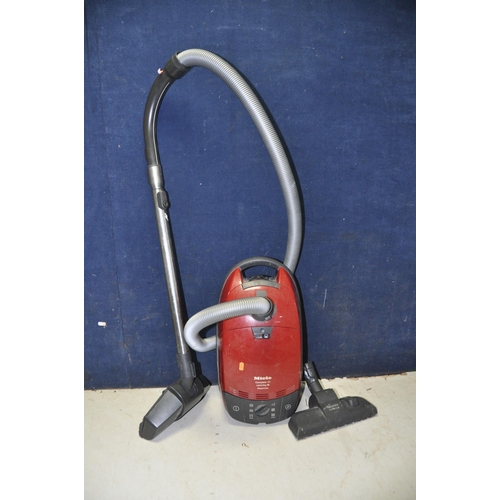 1067 - A MIELE HS05 VACUUM CLEANER with extra brush head (PAT pass and working)