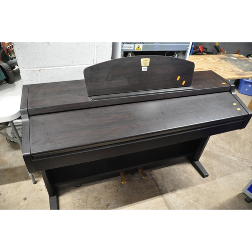 1092 - A YAMAHA CLAVINOVA CLP-920 ELECTIC PIANO with music sheet holder measuring width 136cm x depth 48cm ... 