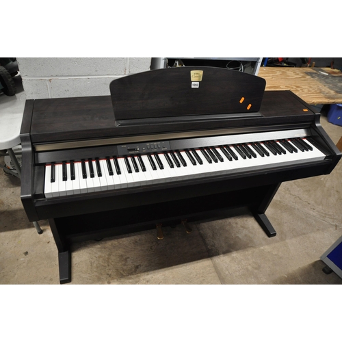 1092 - A YAMAHA CLAVINOVA CLP-920 ELECTIC PIANO with music sheet holder measuring width 136cm x depth 48cm ... 