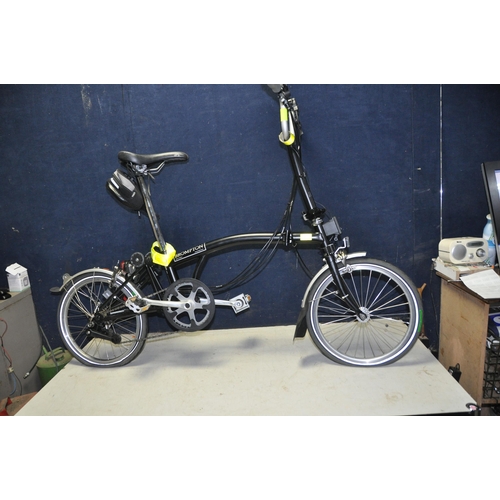 1101 - A BROMPTON FOLDING BIKE WITH BAG in black