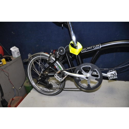 1101 - A BROMPTON FOLDING BIKE WITH BAG in black