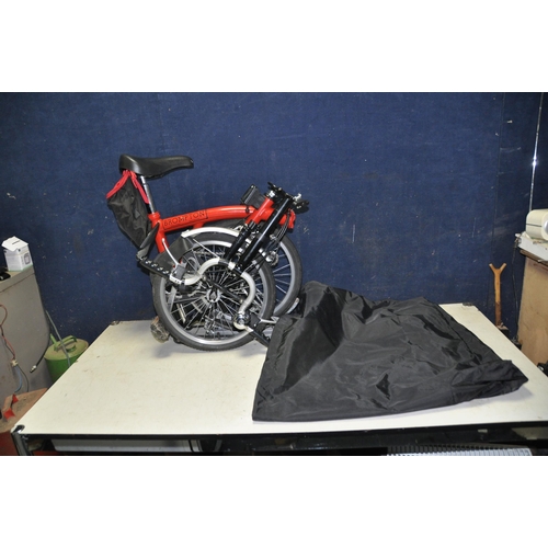 1102 - A BROMPTON FOLDING BIKE WITH BAG in red